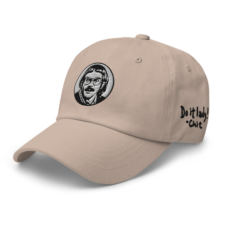 Tan cap featuring Chit Do It Lady design with embroidered graphic and adjustable strap
