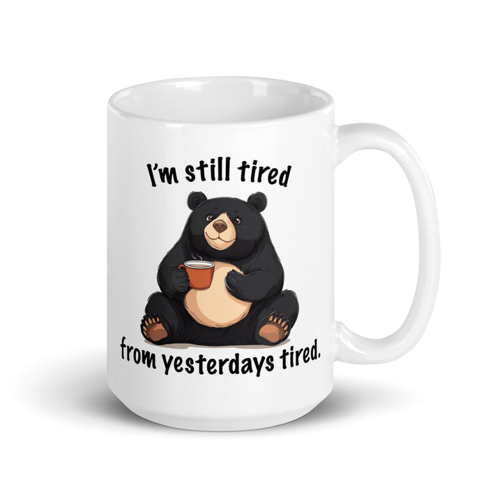 Funny Satire Coffee Mug featuring a bear holding coffee with the phrase I'm still tired from yesterdays tired