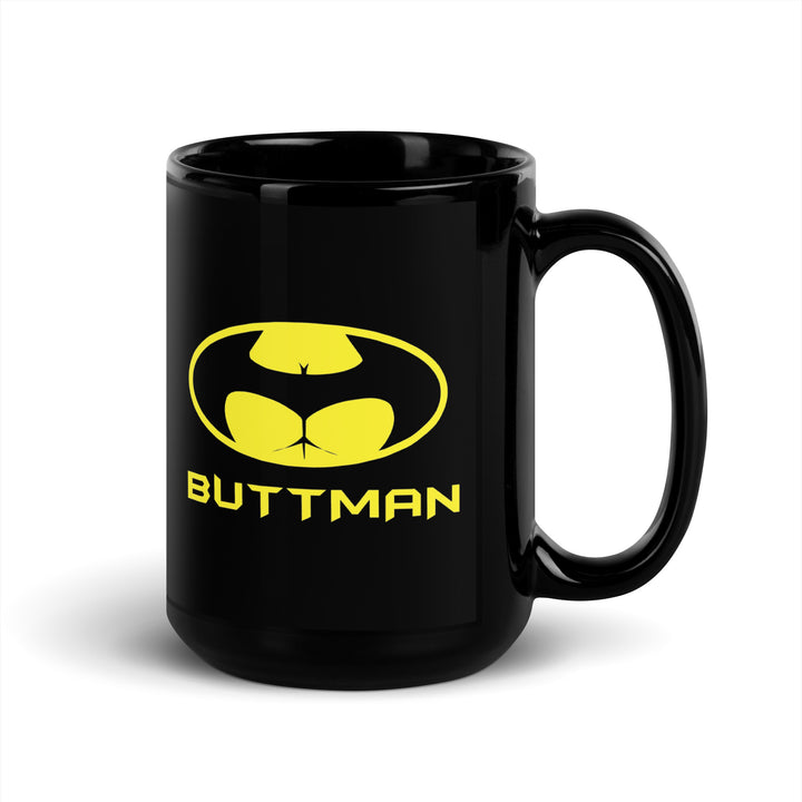 Black Funny Satire Coffee Mug featuring a whimsical 'BUTTMAN' logo design