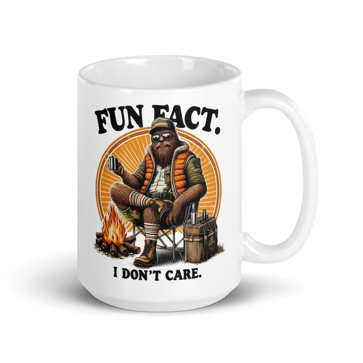 Funny Satire Coffee Mug featuring a relaxed bear with a campfire and the text Fun Fact. I don't care.