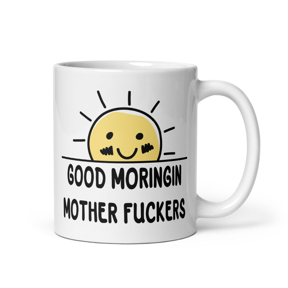 Funny Satire Coffee Mug featuring a cheerful sun and quirky text saying Good Moringin Mother Fuckers