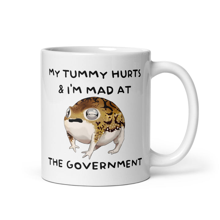 Funny Satire Coffee Mug featuring a frog with the text My Tummy Hurts & I'm Mad at the Government