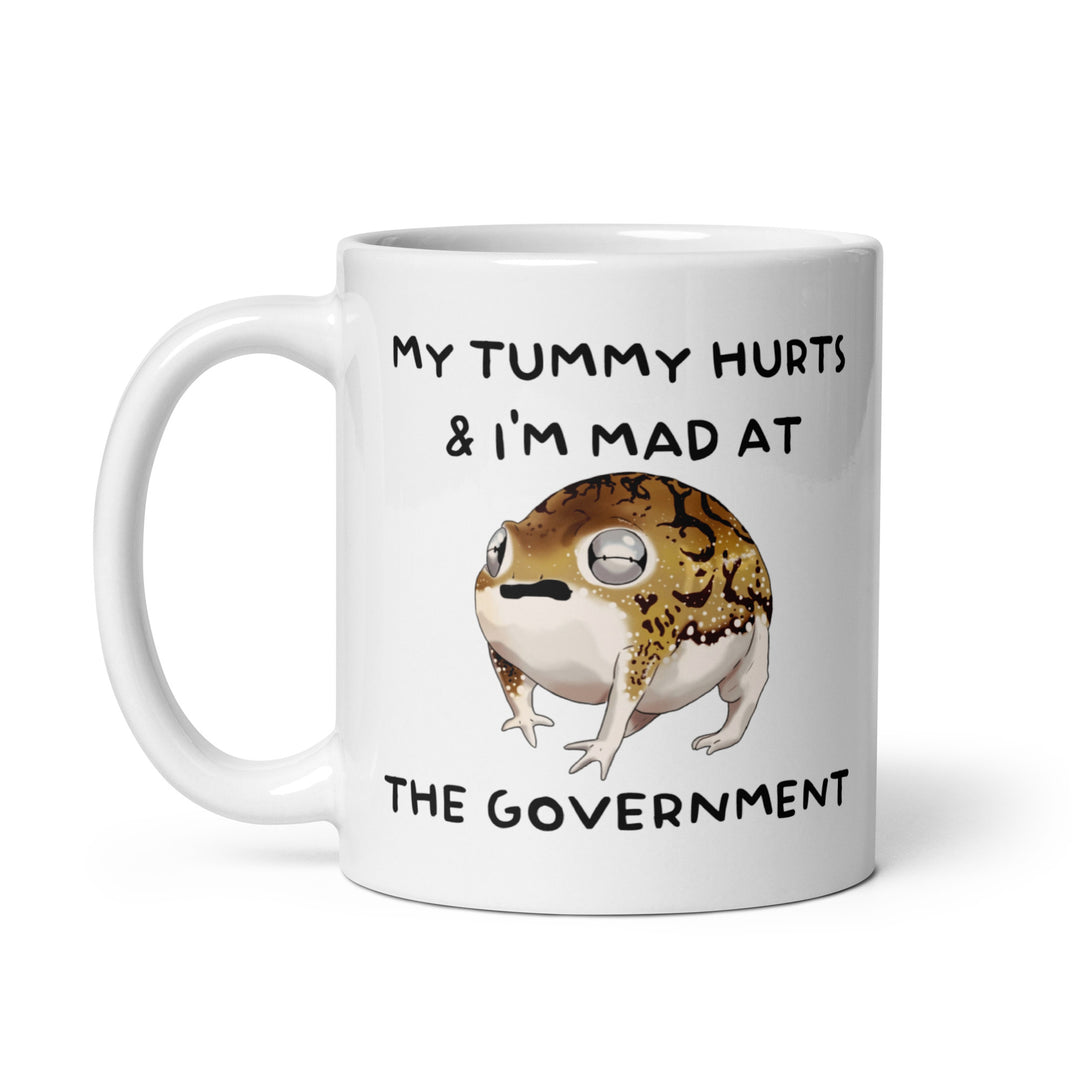 Funny Satire Coffee Mug featuring a frog with the text 'My tummy hurts & I'm mad at the government'