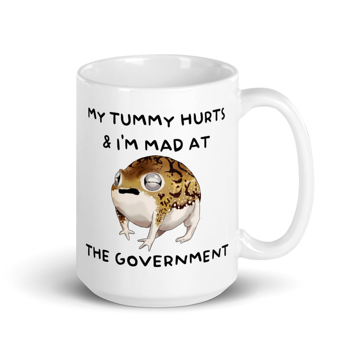Funny Satire Coffee Mug featuring a frog with the text My Tummy Hurts & I'm Mad at the Government