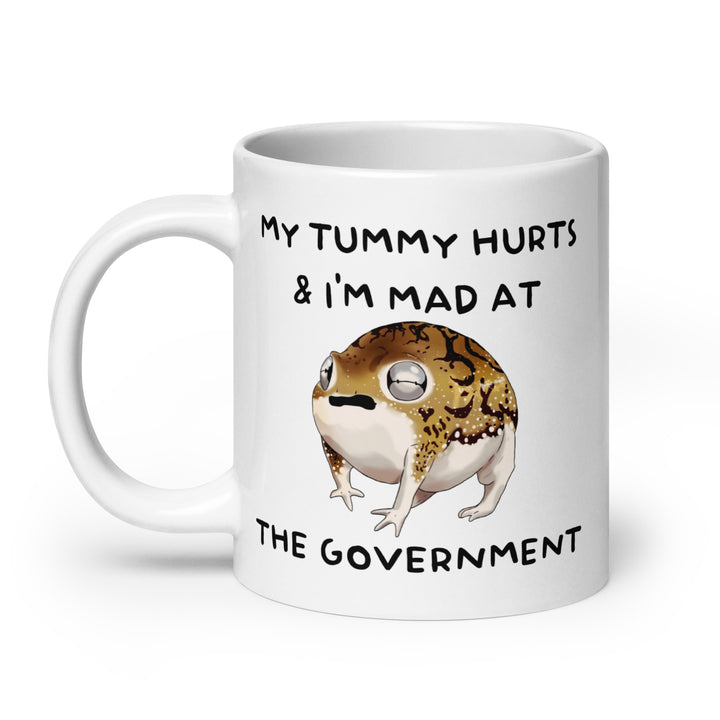Funny Satire Coffee Mug featuring a cartoon frog with a humorous quote about the government