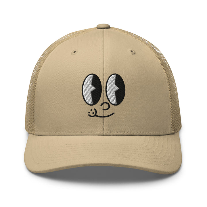 Light beige cap featuring a playful cartoon face, perfect for urban streetwear apparel enthusiasts