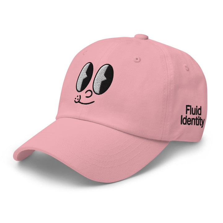 Pink cap featuring cartoon eyes design and Fluid Identity branding for Urban Streetwear Apparel