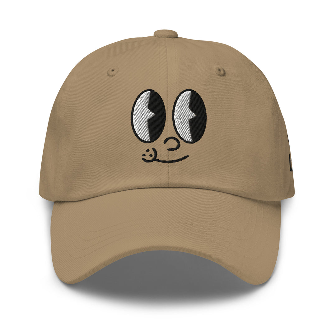 Tan cap with playful cartoon eyes and smile, perfect for Urban Streetwear Apparel enthusiasts
