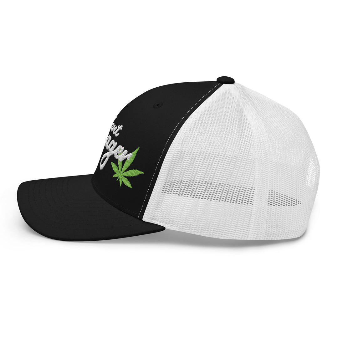 Black and white snapback cap with a green leaf design, perfect for urban streetwear apparel enthusiasts